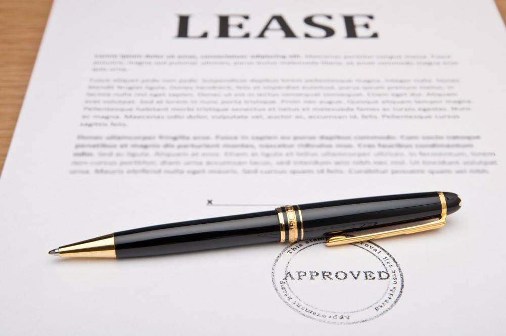 A black pen on lease contract papers